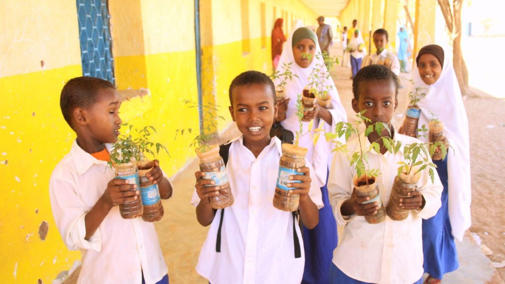 Somali children holding tree seedlings in their hands